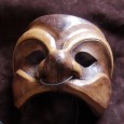 We sit like children waiting for a magic show to begin. The trunk creaks open, and one by one he reveals his treasures: masks of Italy’s traditional <em>Commedia Dell’Arte</em>.