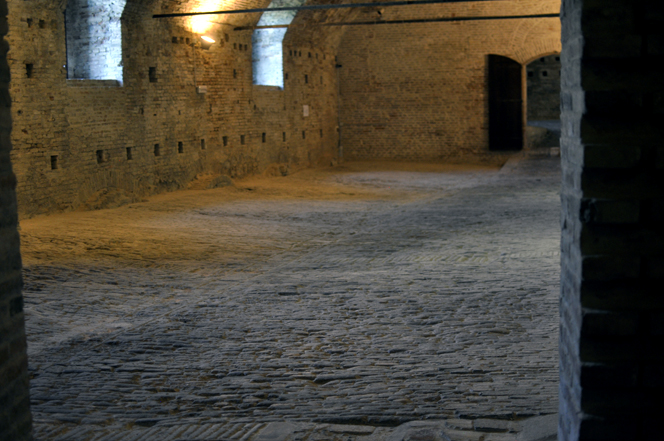 A wide shot of the underground cellar in the Pulazzo Ducale. This area provided an abundant amount of space for Rotondi to store artwork.
