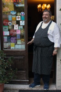 Chef Alberto Melagrana stands in the doorway of the restaurant after a shift in the kitchen and takes in the beautiful city that is Furlo.