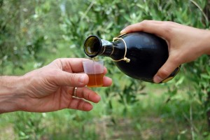 pouring olive liquor