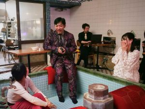 People gather in a tub at an old Japanese bathhouse.